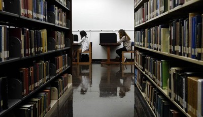 
              HOLD FOR RELEASE ON WEDNESDAY, OCT. 24 AT 12:01 A.M. - In this Friday, Oct. 19, 2012 photo, students study in a library on the campus of California State University, Long Beach in Long 